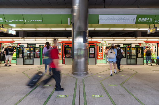 Taichung City, Taiwan - July 3, 2022 : Taichung MRT Metro system. Subway passengers waiting in Green line HSR Taichung station platform.