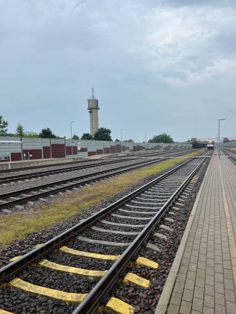 istock Railway tracks sunny day train arriving 1406684751