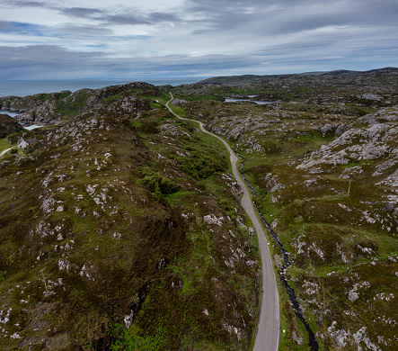 drone view of a coastal road and landscape on the North Coast 500 scenic drive in the Scottish Higlands near Lochniver