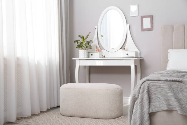 istock Elegant dressing table with mirror near window in bedroom 1406687532