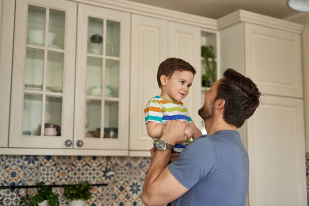 istock Young man spending quality time with his adorable son at home 1406689099