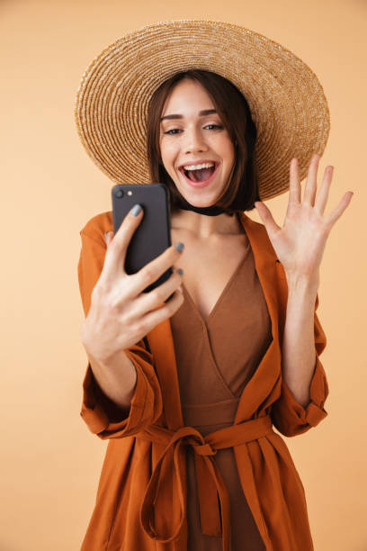 istock Beautiful young woman wearing straw hat 1406692522