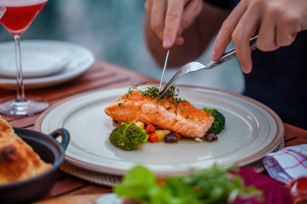 istock Man on luxury dinner served on table with fresh seafood in luxury restaurant 1406692798