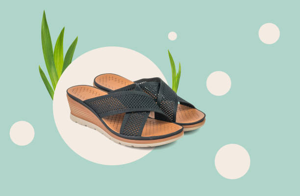 istock Women's summer sandals on an abstract background. 1406694235