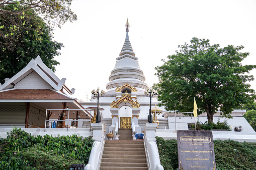 ChiangRai Province, Thailand - 26 Mar 2021, Phra Borommathat Nimit Chedi, the Pagoda on the mountain at Phra That Pha Ngao, the temple and place of Buddhist practices area.
