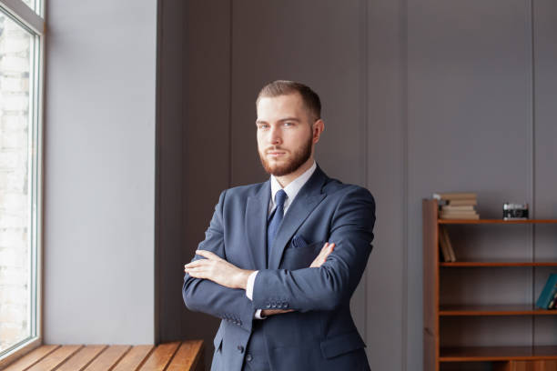 istock Young handsome business man dressed blue navy suit in office 1406697296