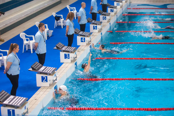 istock Winner celebrating at swimming competition 1406701234