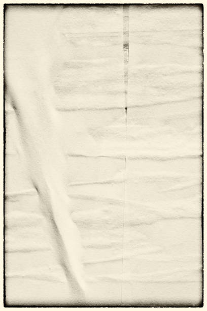istock Blank white black old ripped torn paper crumpled creased posters grunge textures backdrop backgrounds placard 1406705211