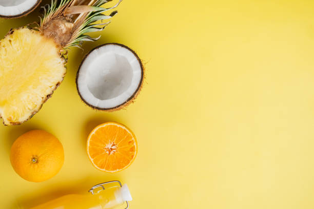 istock Tropical fruit , on yellow textured summer background, top view flat lay, with copy space for text 1406705288