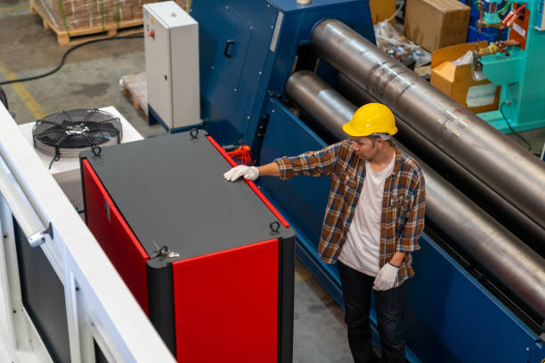 istock Asian man worker working with industrial machine in factory 1406706693
