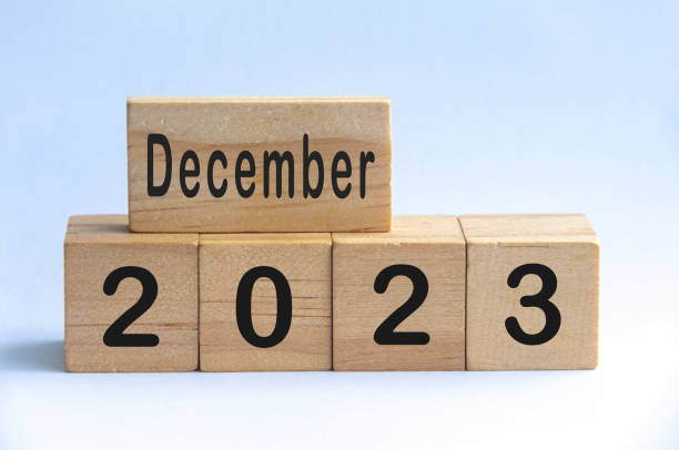 istock December 2023 text on wooden blocks with white color background. Copy space 1406707994