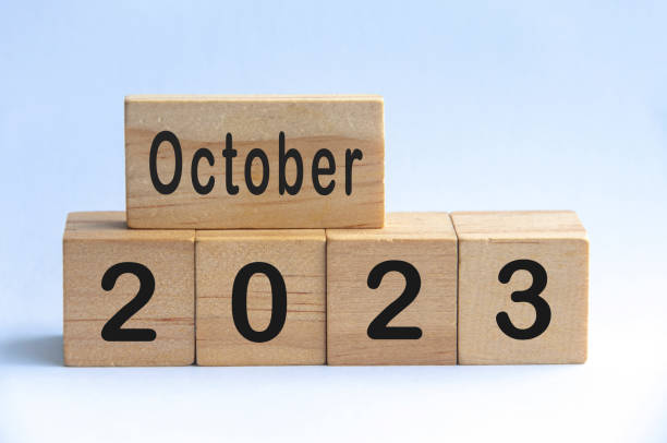 istock October 2023 text on wooden blocks with white color background. Copy space 1406708023