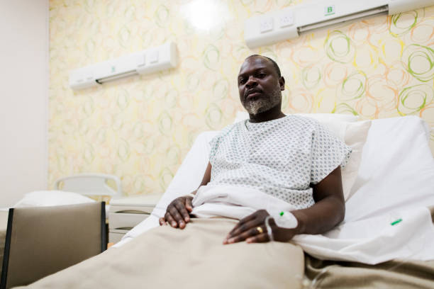 istock Candid low angle portrait man in hospital bed 1406712313