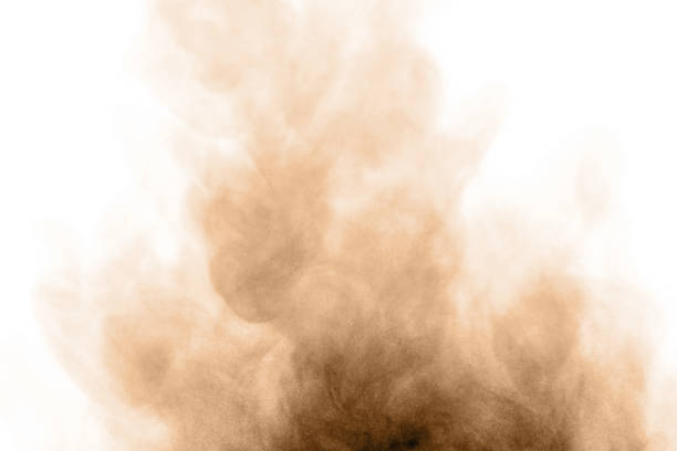 istock Brown black dust powder explosion. The texture is abstract and splashes float. 1406712551