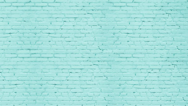 istock Light teal color old rough brick wall texture. Pastel turquoise aged masonry. Abstract grunge vintage textured background 1406714600