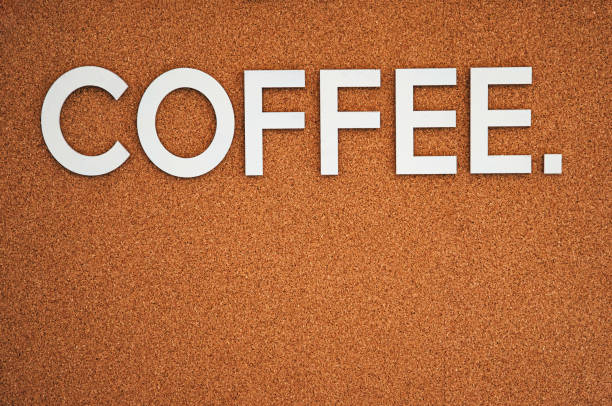 istock White word Coffee on brawn cork background copy space. 1406717259