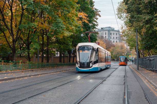 istock Two modern trams driving along Dostoevsky Lane in different directions. Historical center of Moscow. 1406721243