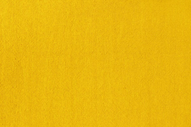 istock Yellow golden cotton fabric cloth texture for background, natural textile pattern. 1406721902