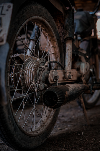 A vintage, old rusty bike wheel. Vehicle wheel close up, dirt, grime.