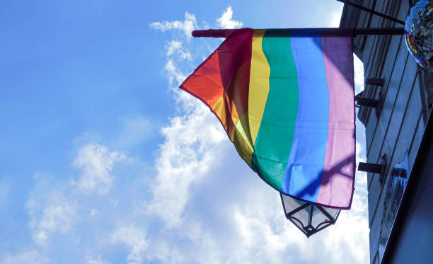 istock Pride rainbow lgbt gay flag being waved on sky background 1406723097