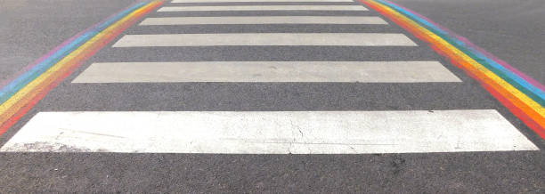 istock Marked crosswalk with lbgtq pride flag rainbow stripes 1406723107