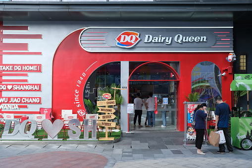 Shanghai,China-July 2nd 2022: DQ Dairy Queen store facade exterior and customers.