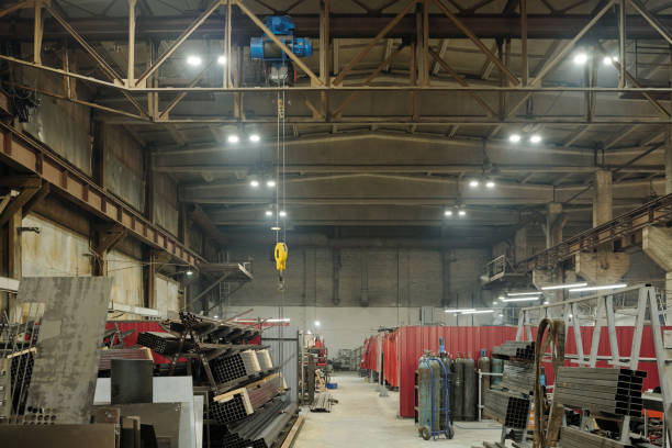 istock Interior of spacious workshop with construction materials and equipment 1406725342