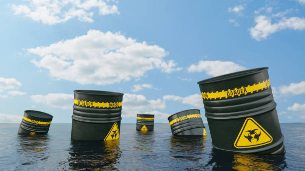 istock Biohazard Toxic Waste Barrels  Floating on the Ocean 1406727043