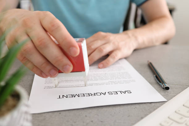 istock Business people approval stamp on sale agreement. 1406727268