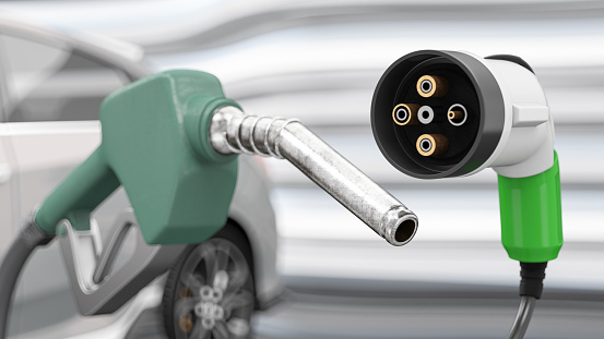 Electric Vehicle EV Charging Plug and Gas Nozzle. 3D Render