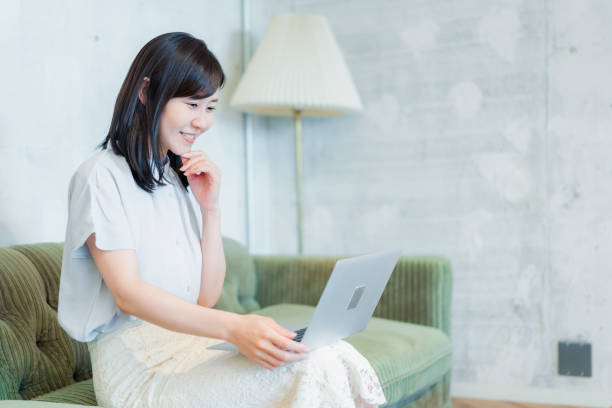 istock Businesswoman using a computer in the lounge 1406732012
