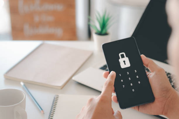 istock Hacking a Phishing mobile phone with a password to access a smartphone, security threats online. 1406732021