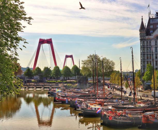 This harbor was built in 1350 in Rotterdam, Netherlands. The modern Willemsbruge bridge is in the background
