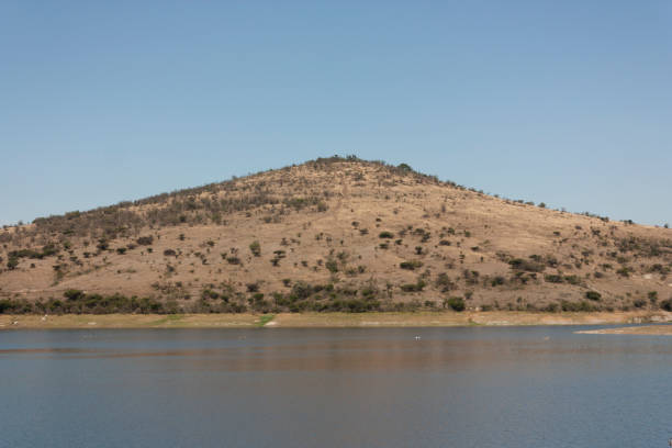 fresh water in the morning next to a mountain horizontal scene