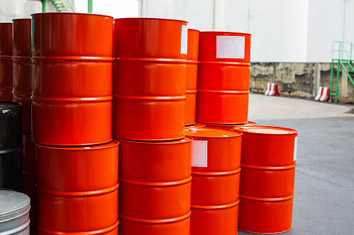 Oil barrels red or chemical drums vertical stacked up the industry.