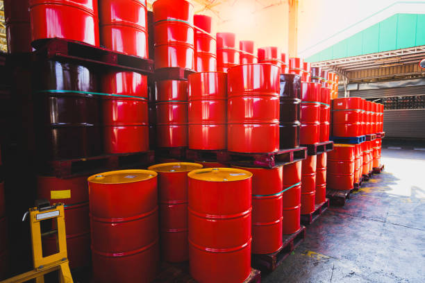 istock Red oil barrels chemical drums vertical stacked up 1406735964