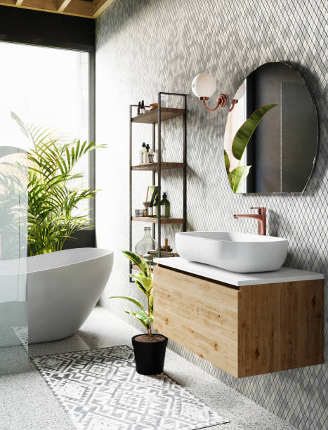 istock Modern bathroom interior with grey tiled walls, round mirror, white bath and large window. 3d rendering 1406736061