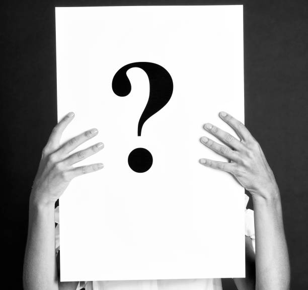 istock Woman Holding Question Mark Sign. 1406736802
