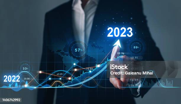 Businessman Draws Increase Arrow Graph Corporate Future Growth Year 2022 To 2023 Planningopportunity Challenge And Business Strategy New Goals Plans And Visions For Next Year 2023 Stock Photo - Download Image Now