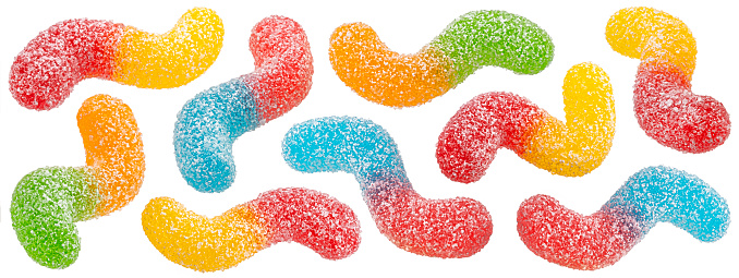 Falling sour gummy worms isolated on white background, full depth of field