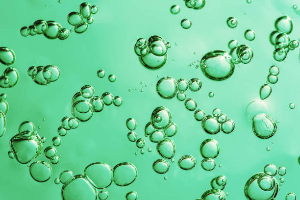 istock Close up macro Aloe vera gel cosmetic texture blue background with bubbles. 1406744058