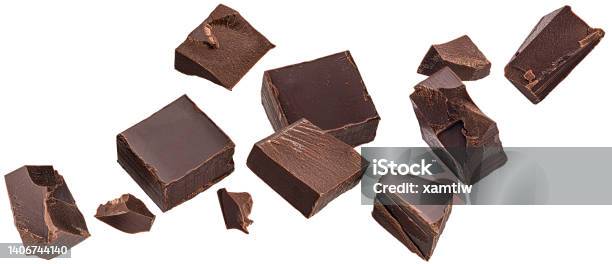 Falling Chocolate Pieces Isolated On White Background Stock Photo - Download Image Now