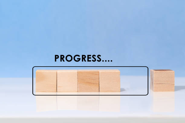istock Wooden cube on virtual infographic rectangle block with progress wording. Job progressive concept 1406744629