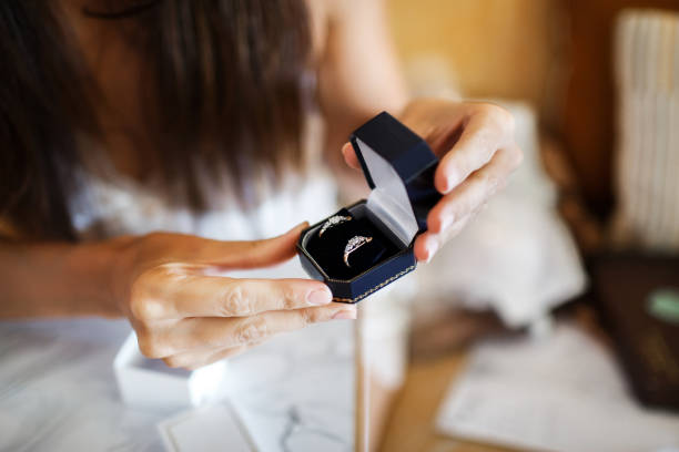 Box with rings in the hands of the bride