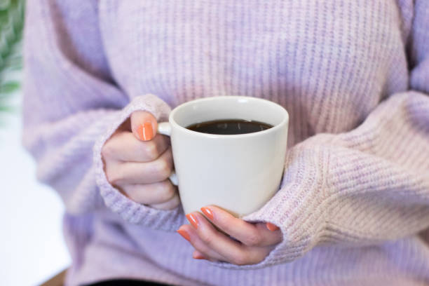 istock filter coffee in white mug, woman holding in hand 1406746802