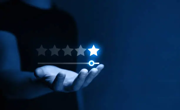 Photo of Five star rating feedback on virtual sreen.Concept of satisfaction, quality and performance