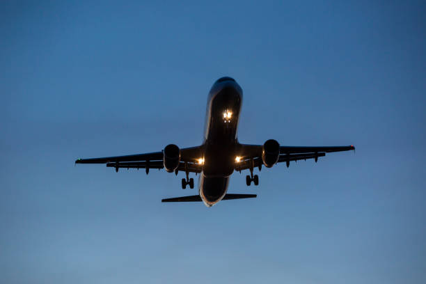 istock Landing airplane at dusk 1406748245