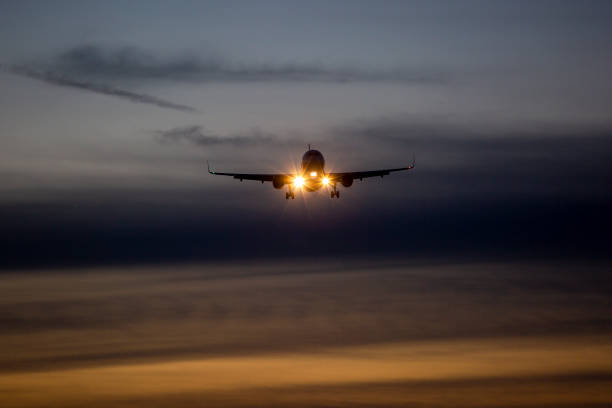 istock Landing airplane at dusk 1406748252