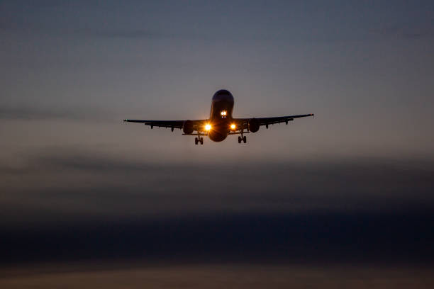 istock Landing airplane at dusk 1406748304