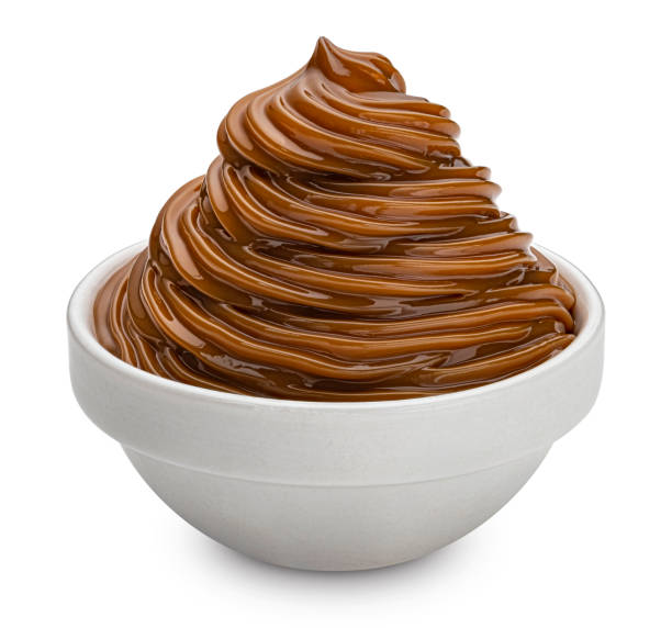 istock Caramel cream isolated on white background, full depth of field 1406749660